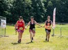 three-runners-hold-hands-as-they-approach-the-finish-line