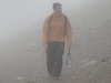 man-walking-through-fog-carrying-a-bottle-of-water