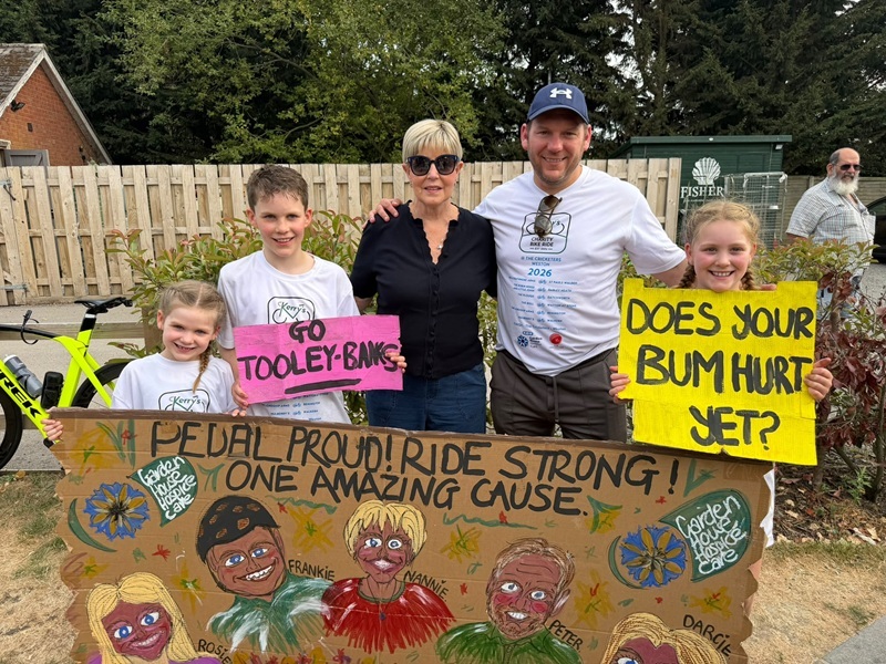 the-tooley-banks-family-holding-signs-at-the-cycling-event