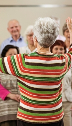 a-woman-conducts-a-community-choir