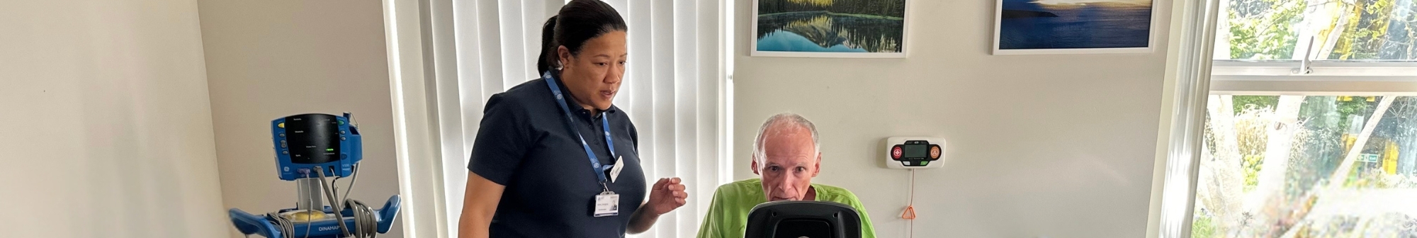 physiotherapist-althea-observes-patient-on-exercise-bike