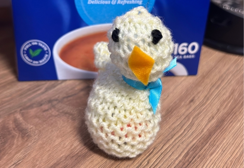 knitted-chicks-in-front-of-a-box-of-tea-bags