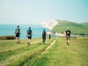 four-people-walking-along-the-coast-on-the-isle-of-wight-ultra-challenge