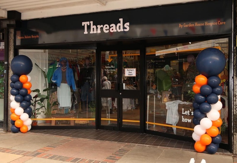 threads-shop-front-surrounded-by-balloons