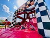 a-family-slide-down-an-obstacle-at-the-inflatable-5k