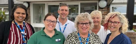 a-group-of-hospice-staff-stand-together (cropped)