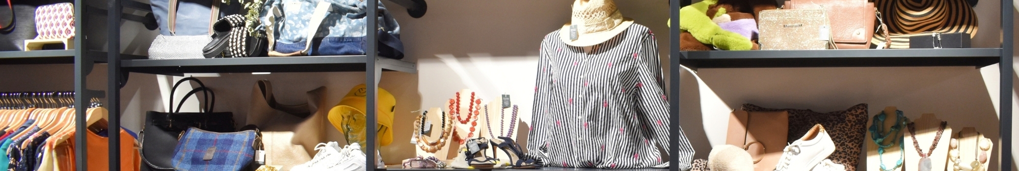shelving-unit-full-of-clothes-and-accessories-in-our-hitchin-store