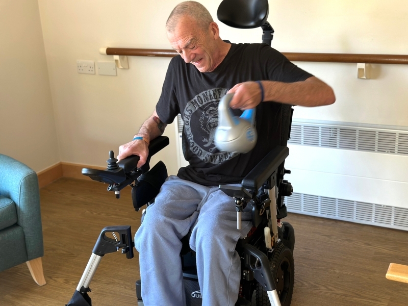 a-patient-in-a-wheelchair-lifting-weights